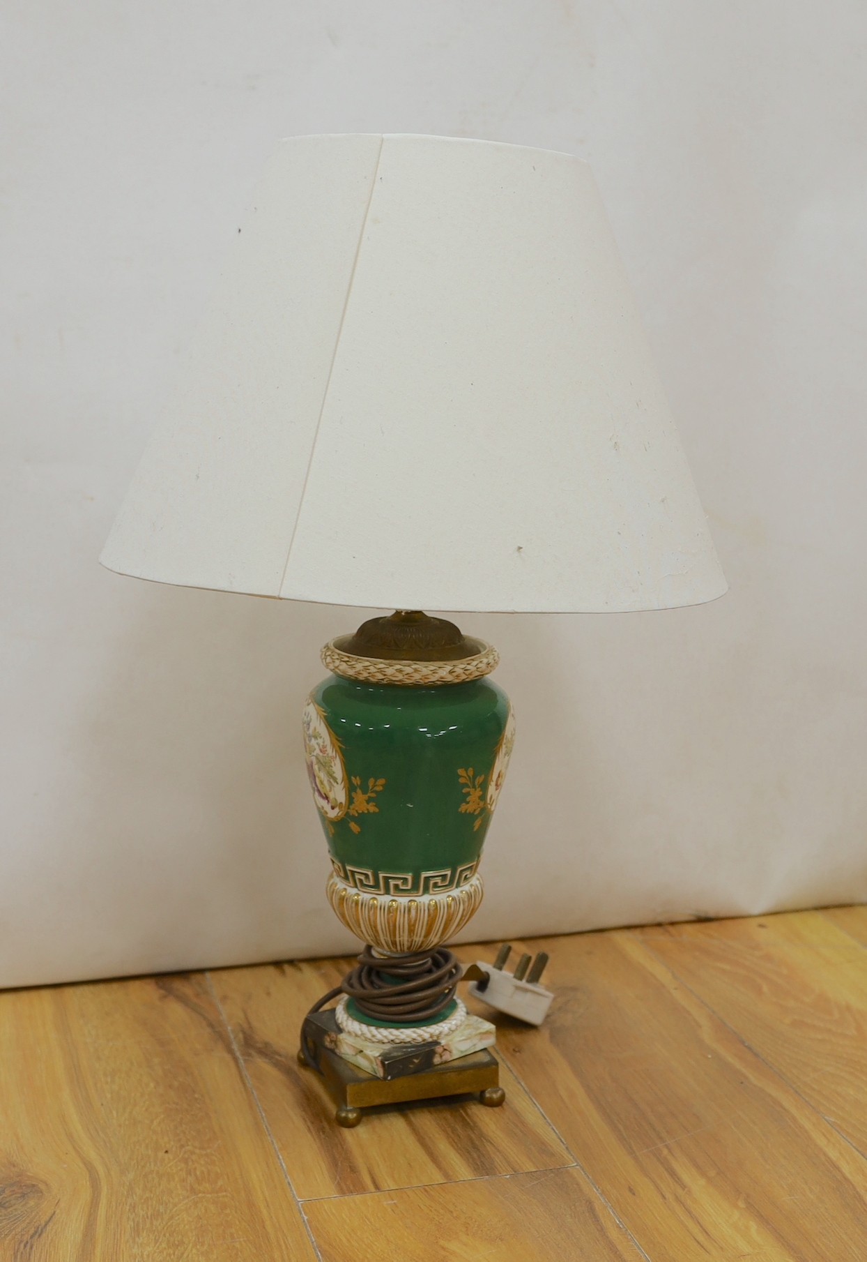A Coalport style green and gilt ground floral painted vase, fitted as a table lamp